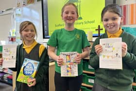 Scalford Primary School pupils Erin, Elaina and Freya show off their winning designs in the Easter card contest organised by Ironstone Churches
