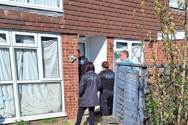 Council officials and police officers pictured closing up one of four Melton Mowbray properties this week