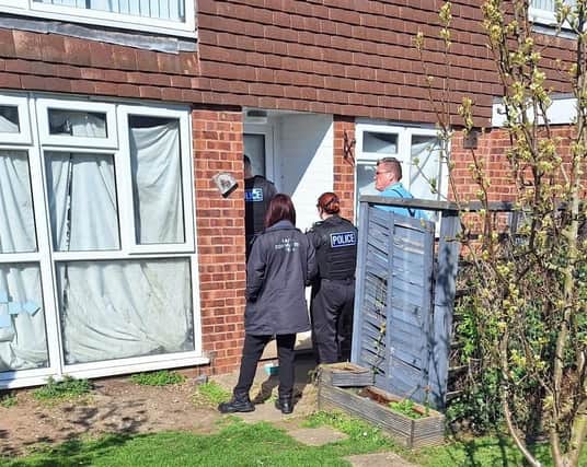 Council officials and police officers pictured closing up one of four Melton Mowbray properties this week
