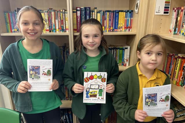 Florence Skipper (centre), the winner of the Ironstone Family of Churches Christmas card design competition, with Lila Chaumillon (left) and Chloe Moulds, who were also judged in the top three