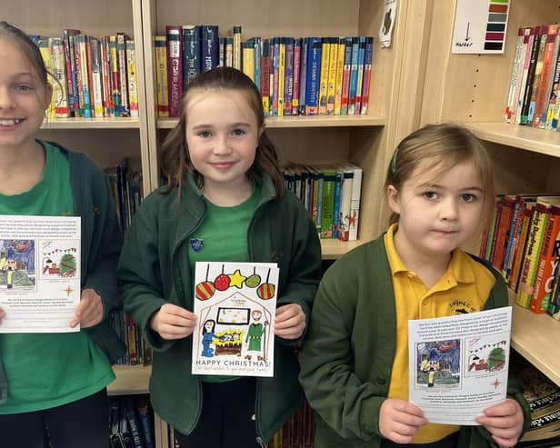 Florence Skipper (centre), the winner of the Ironstone Family of Churches Christmas card design competition, with Lila Chaumillon (left) and Chloe Moulds, who were also judged in the top three
