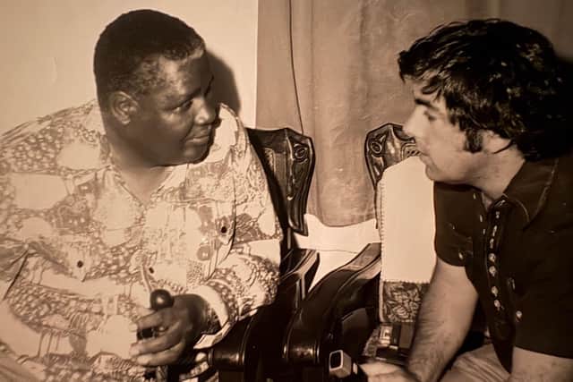 Peter Butler interviewing Joshua Nkomo, the leader and founder of the Zimbabwe African People's Union (ZAPU), when Zimbabwe was formed