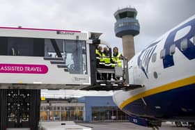 Amanda Hack MP receiving a demonstration of the new electric ambulift from EMA customer services staff