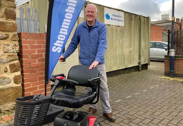 Glyn Birch, coordinator of Shopmobility Melton Mowbray, with one of the scooters he rents out