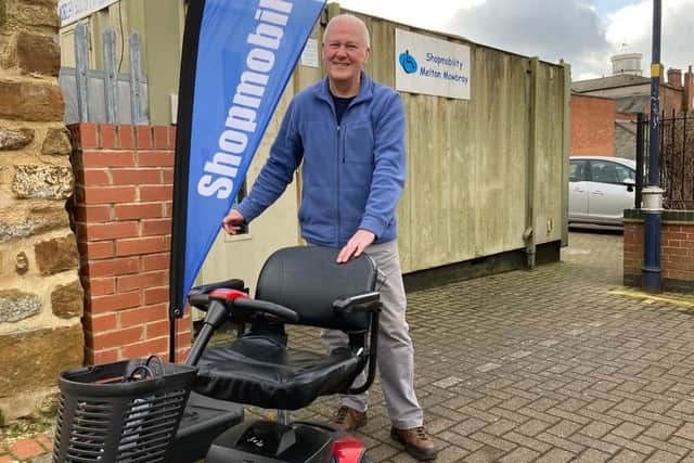 Glyn Birch, coordinator of Shopmobility Melton Mowbray, with one of the scooters he rents out