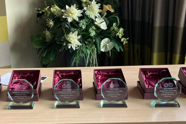 The long-service awards presented to seven Melton taxi drivers