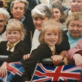 The day The Queen came to Melton in 1996 - sister Laura (right) and Kelly Simmonds watch The Queen visiting Melton. This picture was taken by the Melton Times photographer at the time.