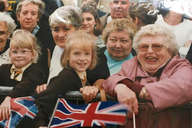 The day The Queen came to Melton in 1996 - sister Laura (right) and Kelly Simmonds watch The Queen visiting Melton. This picture was taken by the Melton Times photographer at the time.