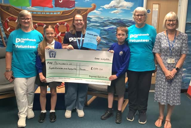 Whissendine School Young Governors present a cheque to Parkinson's UK