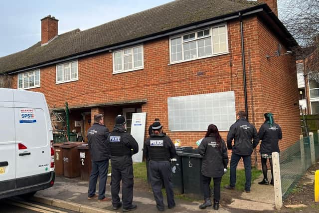 Council officials and police officers effect a property closure in Melton