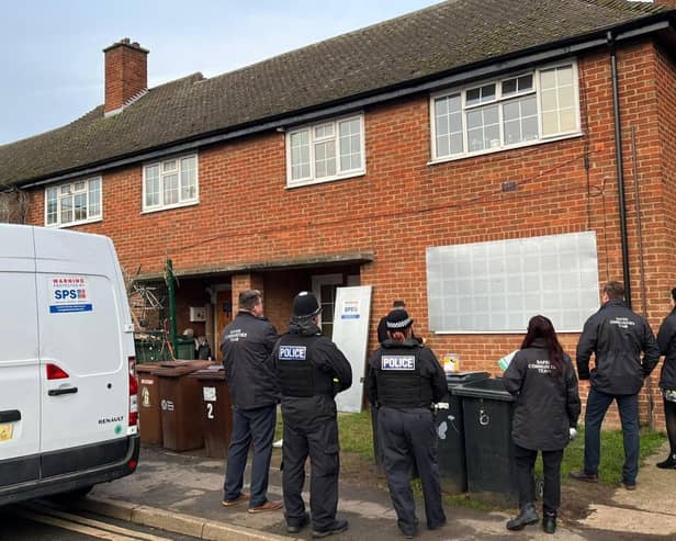 Council officials and police officers effect a property closure in Melton