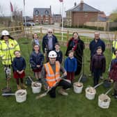 Stathern Primary School pupils help plant trees at the new Davidson development in the village