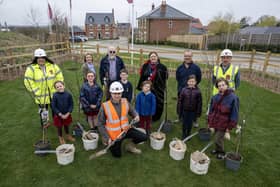 Stathern Primary School pupils help plant trees at the new Davidson development in the village