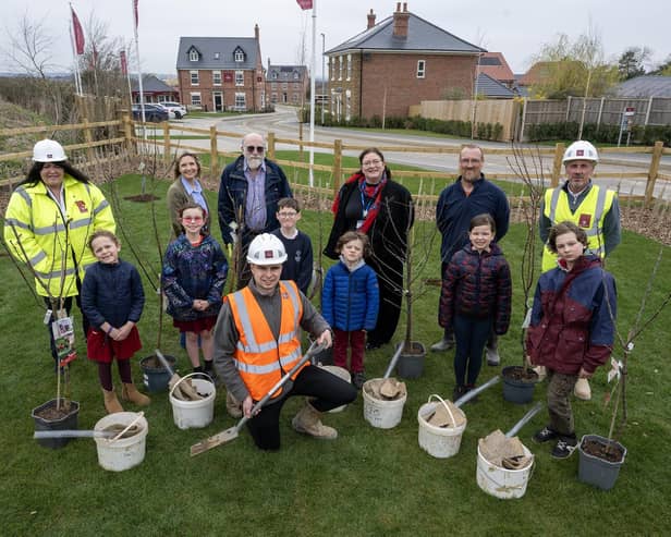 Stathern Primary School pupils help plant trees at the new Davidson development in the village