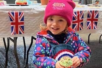 Annie Skinner proudly shows off her highly commended rosette for her Christmas cupcakes at the Melton Fatstock Show