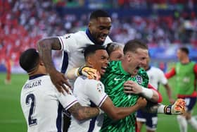 DUSSELDORF, GERMANY - JULY 06: Trent Alexander-Arnold of England celebrates scoring the team's fifth and winning penalty in the penalty shoot out with teammates Kyle Walker, Ivan Toney and Jordan Pickford  during the UEFA EURO 2024 quarter-final match between England and Switzerland at Düsseldorf Arena on July 06, 2024 in Dusseldorf, Germany. (Photo by Dean Mouhtaropoulos/Getty Images)