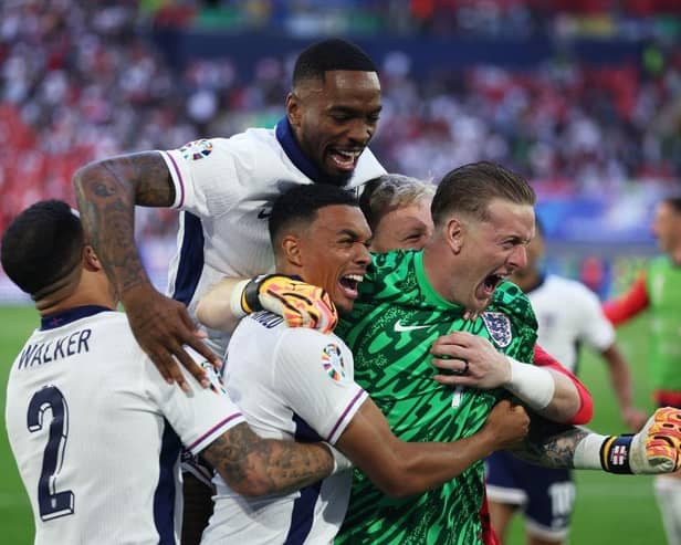 DUSSELDORF, GERMANY - JULY 06: Trent Alexander-Arnold of England celebrates scoring the team's fifth and winning penalty in the penalty shoot out with teammates Kyle Walker, Ivan Toney and Jordan Pickford  during the UEFA EURO 2024 quarter-final match between England and Switzerland at Düsseldorf Arena on July 06, 2024 in Dusseldorf, Germany. (Photo by Dean Mouhtaropoulos/Getty Images)