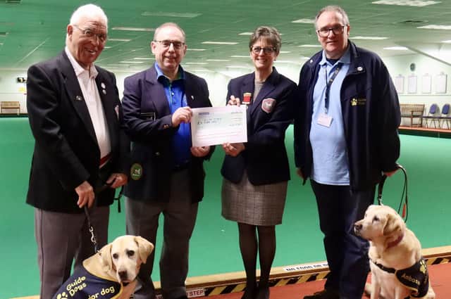 From left, bowls club director David Armstrong with Rusty, club chairman Martin Cooke, president Hazel Armstrong and volunteer Steve Giles, with Cassie.