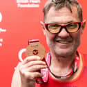 John Houghton with his medal after completing Sunday's TCS London Marathon in aid of the British Heart Foundation