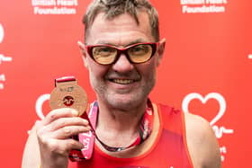 John Houghton with his medal after completing Sunday's TCS London Marathon in aid of the British Heart Foundation