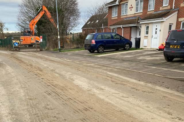 One of the busy roads close to the Lake Terrace building site which is caked with mud from house building work