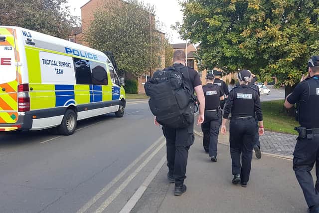 Officers prepare to raid a property in Rutland Street, Melton, where drug-related activity was suspected