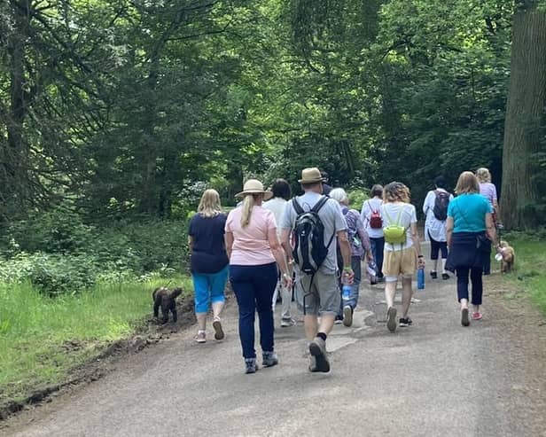 Walkers enjoying the last Dove Cottage Hospice wellbeing walk at Belvoir Castle in May