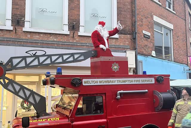 Santa greets Melton shoppers on the town fire brigade's fundraising Trumpton engine