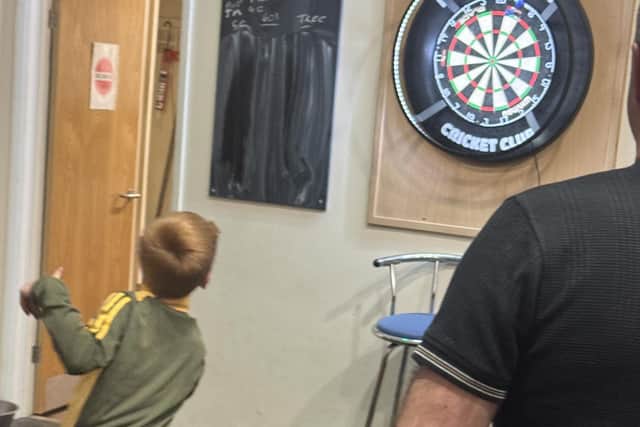 Jake Moore (eight) shows off his darts skills
