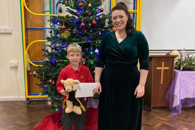 Rutland and Melton MP Alicia Kearns with the winner of her Christmas card competition, Marcus of English Martyrs Catholic Voluntary Academy in Oakham