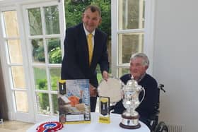 Peter Holmes, of Thrussington's Manor Farm, is presented with the salver award by Long Clawson Dairy chairman Paul Eggleston