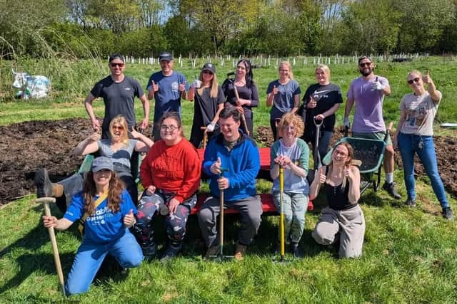 The guys at Welly's Work Place with Sunny Skies enjoying a gardening activity