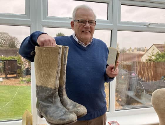 Malcolm Britton at home with his dad's repaired boots and his wartime diary following his emotional appearance on The Repair Shop