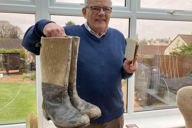Malcolm Britton at home with his dad's repaired boots and his wartime diary following his emotional appearance on The Repair Shop
