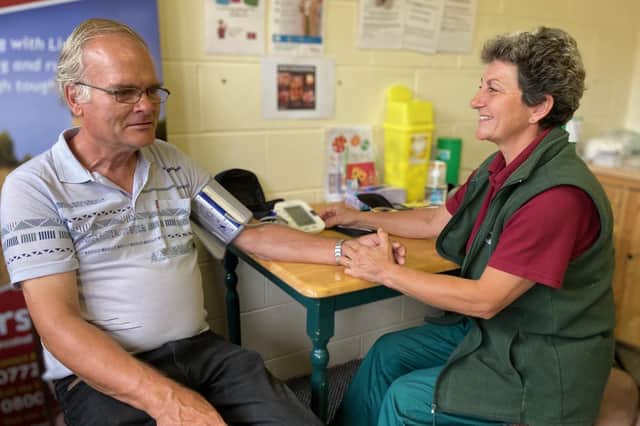 Nurse Heather Dawes carries out a blood pressure check today at Melton market