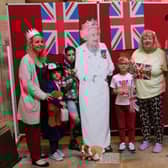 People have their picture taken with 'Her Majesty' at a royal-themed activities morning at Melton's St Mary's Church
PHOTO PHIL BALDING
