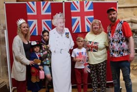 People have their picture taken with 'Her Majesty' at a royal-themed activities morning at Melton's St Mary's Church
PHOTO PHIL BALDING