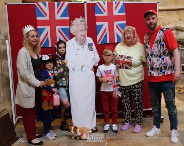 People have their picture taken with 'Her Majesty' at a royal-themed activities morning at Melton's St Mary's Church
PHOTO PHIL BALDING