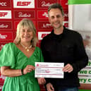 Martyn Young, director at ESF Events, presents a cheque for more than £6,000 to Barbara Elsey, the NSPCC’s Community Fundraising Manager for the East Midlands, from this year's fundraising effort for the charity