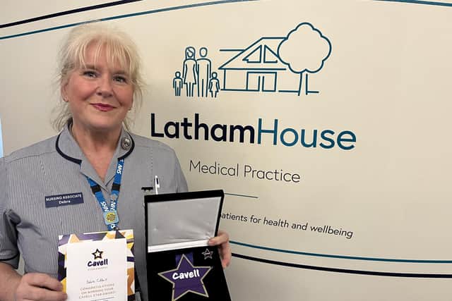 Debra Gilbert, a nurse at Melton Mowbray's Latham House Medical Practice, with her Cavell Star Award