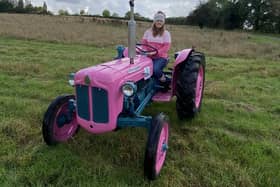 Anna Griffiths driving her stunning pink Fordson Dexta
