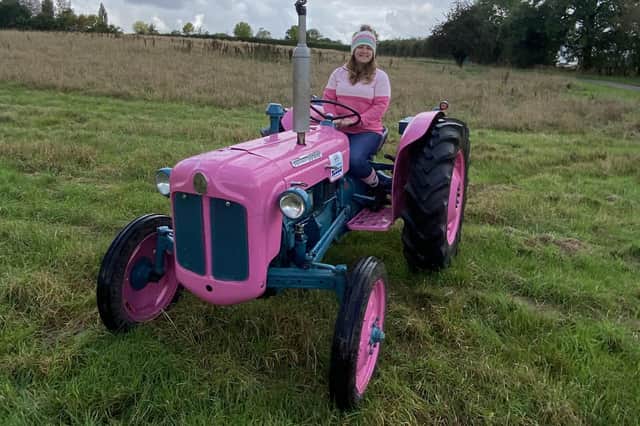 Anna Griffiths driving her stunning pink Fordson Dexta