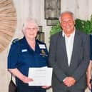 Melton Community First Responders: Ina and Peter Scott receive a cheque from the Ragdale Hall Community Chest in 2023 PHOTO Adam Shaw (www.adam-shaw.co.uk)