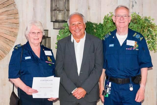 Melton Community First Responders: Ina and Peter Scott receive a cheque from the Ragdale Hall Community Chest in 2023 PHOTO Adam Shaw (www.adam-shaw.co.uk)