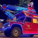 Santa rides the Trumpton fire engine during this year's Melton fundraising effort by local firefighters
