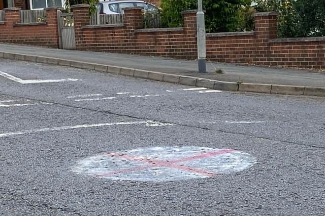 Another mini roundabout in Dalby Road with the cross of St George painted on it