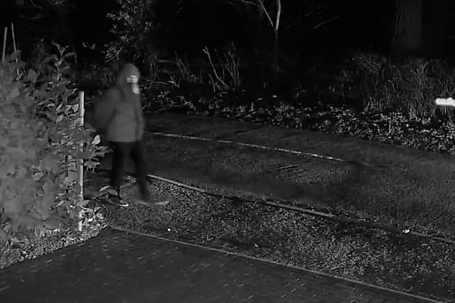 A grainy CCTV image showing Jessop lurking outside Clair's home in Colston Bassett