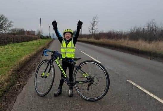 Rupert Brooke celebrates his fundraising efforts cycling up the highest hills in the Vale of Belvoir in aid of Dove Cottage Hospice last year
