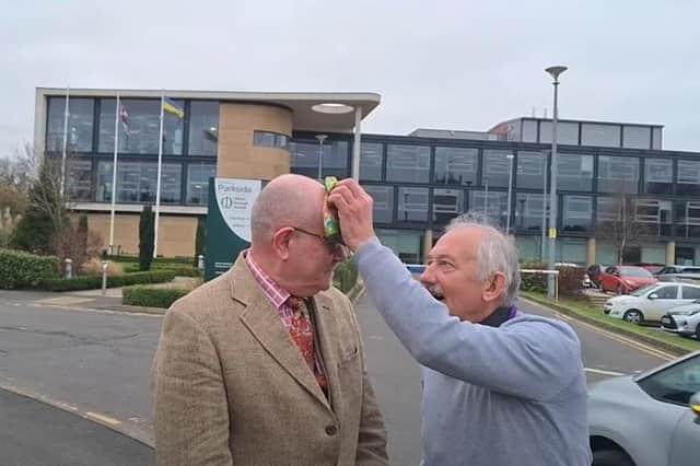 The moment Melton Borough Council leader, Councillor Pip Allnatt, dabbed the forehead of Matthew Bland with a handkerchief as he was filming a You Tube video outside the council offices in Parkside