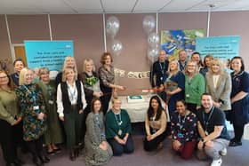 Colleagues gather to celebrate the launch of the Healthy Together Helpline, with director of families, young people, children, learning disability and autism services at Leicestershire Partnership NHS Trust, Helen Thompson (centre), cutting a ribbon to mark the occasion